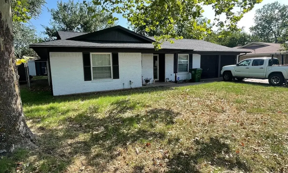 Professional roofing crew working on a residential roof in Shreveport